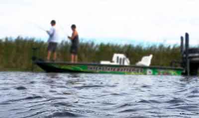 Men fishing in an Interstate Batteries boat