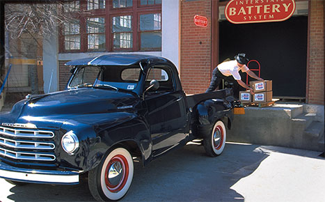 John Searcy loading batteries into his truck
