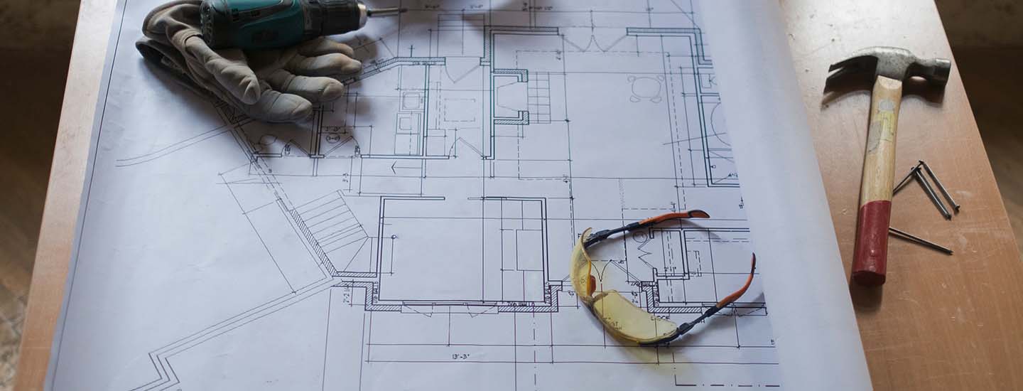 Commercial Business  - blueprints on a desk