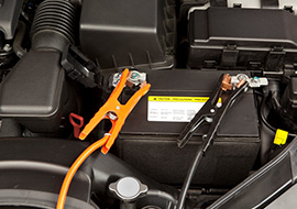 battery connected to jumper cables