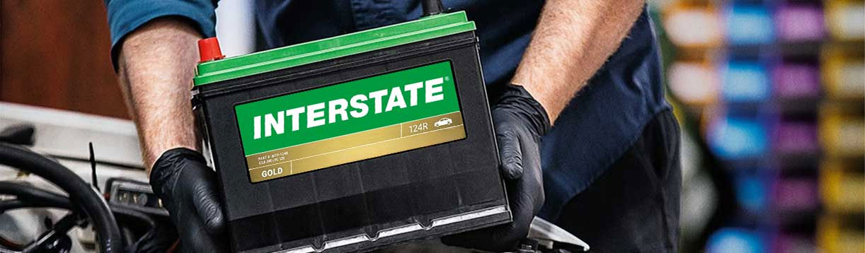 Tech installing an Interstate battery