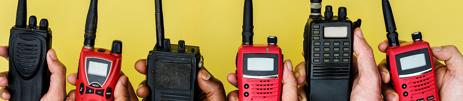 Two way radios on top of yellow background
