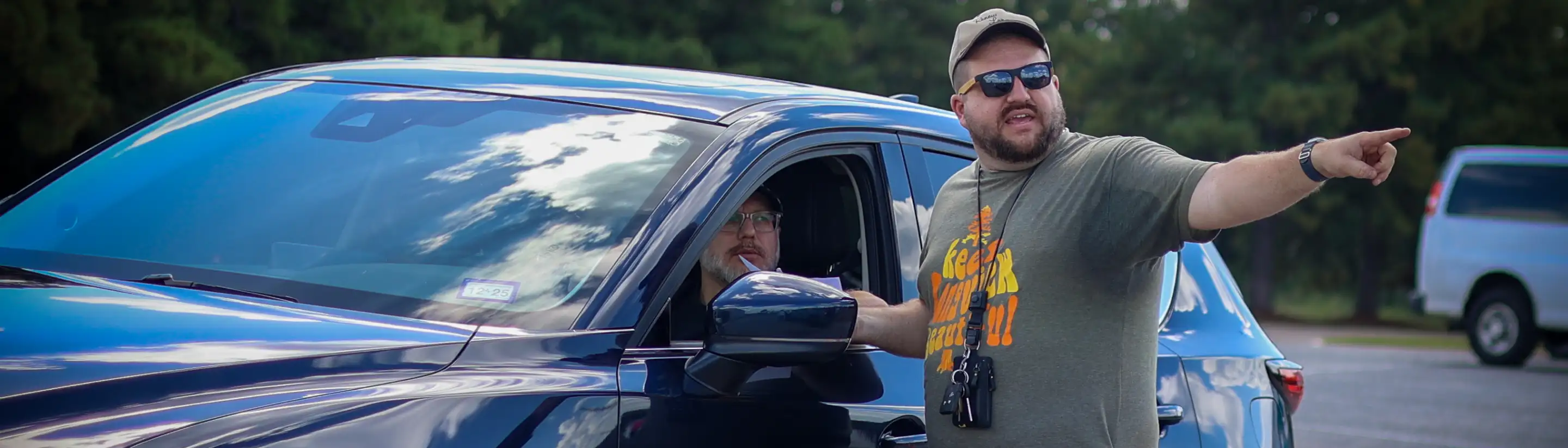 Interstate All Battery Center employee giving directions at Recycling event
