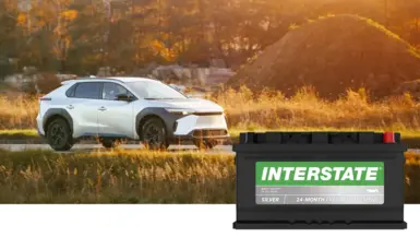 image of car on road with Interstate MT battery