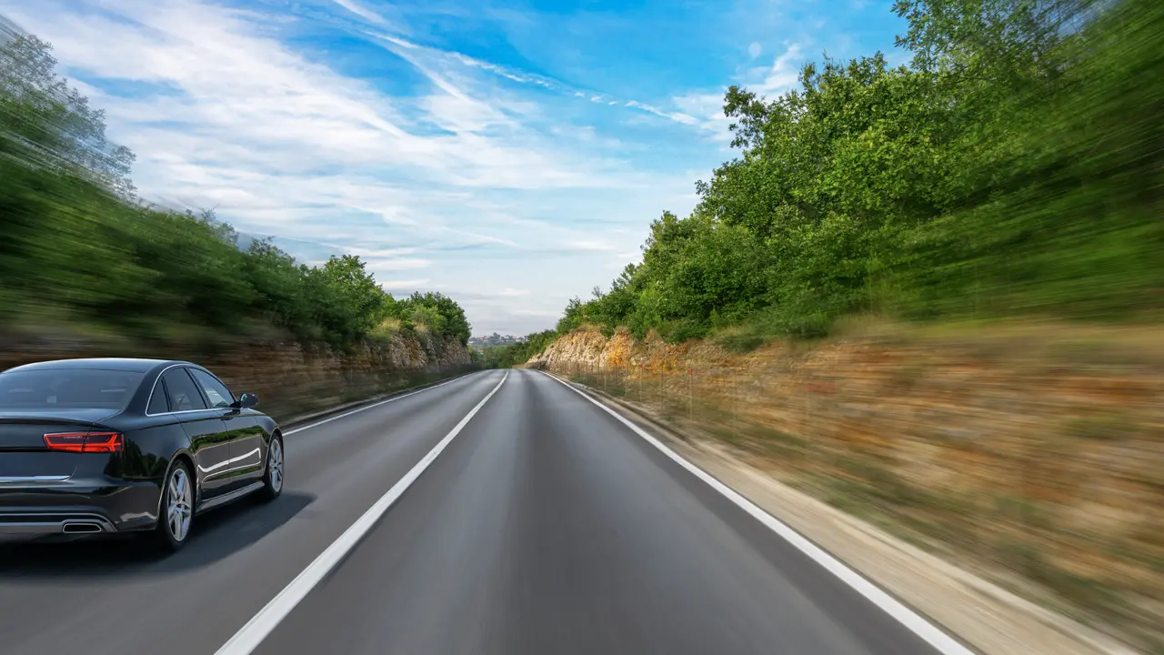 car driving down highway