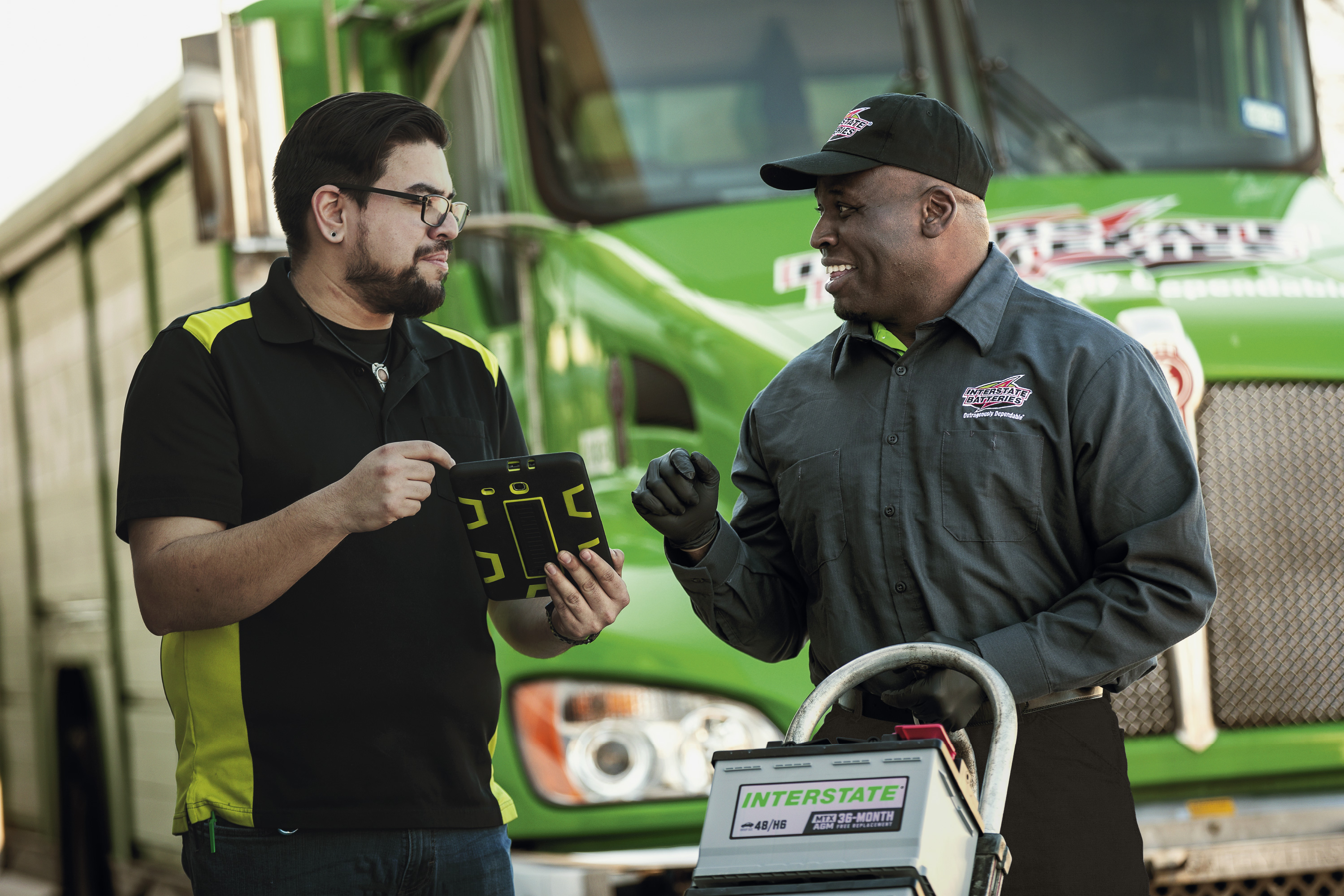 Interstate Batteries representative and dealer working together