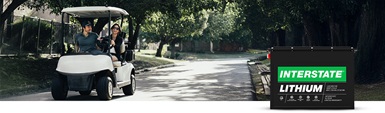 An image of golfers driving golf cart with Interstate Lithium Battery overlaid on photo