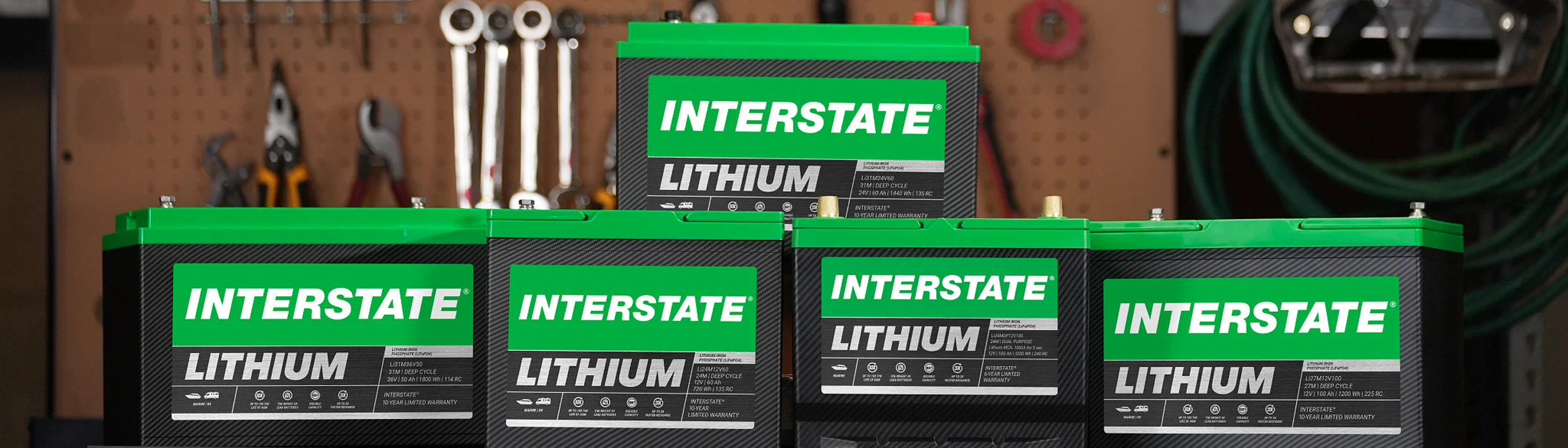 stack of Lithium Interstate Batteries in tool shed