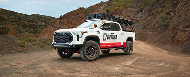 Optima auto vehicle on mountain terrain