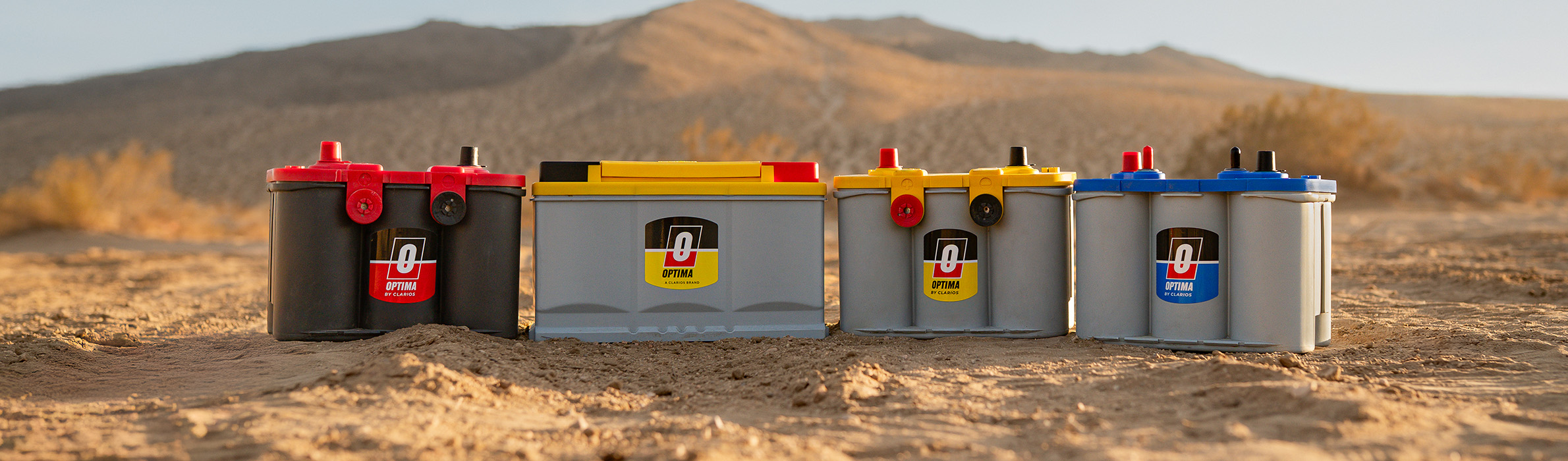 lineup of Optima batteries in the desert