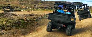 Image of UTVs on off-road track