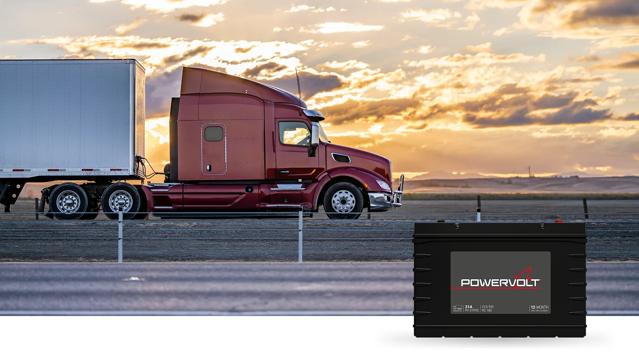 Semi-truck on the highway in the sunset with PowerVolt Battery in bottom right corner