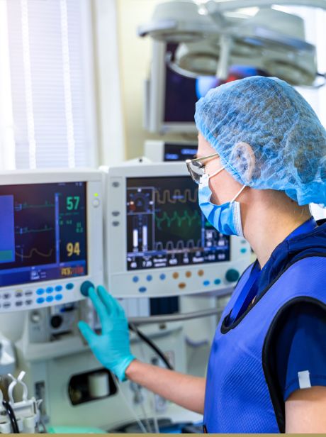 Hospital worker using medical equipment