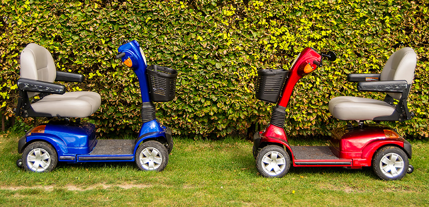 red and blue mobility scooters facing each other
