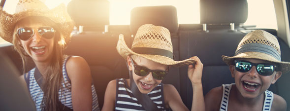 kids in car on a road trip