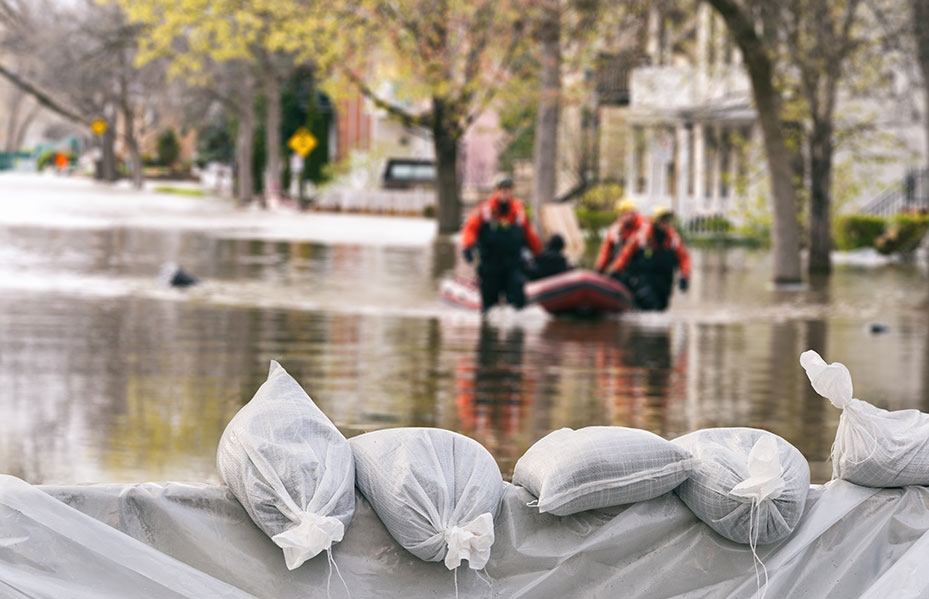 flooded streets, sandbags, rescue workers