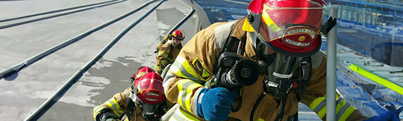 Firefighters walking up stairs