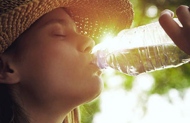 Person drinking water on hot day