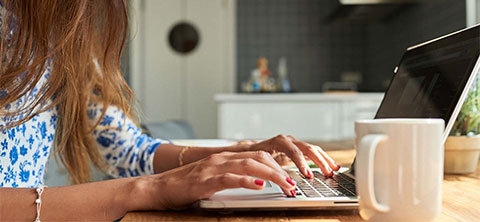 Person typing on laptop