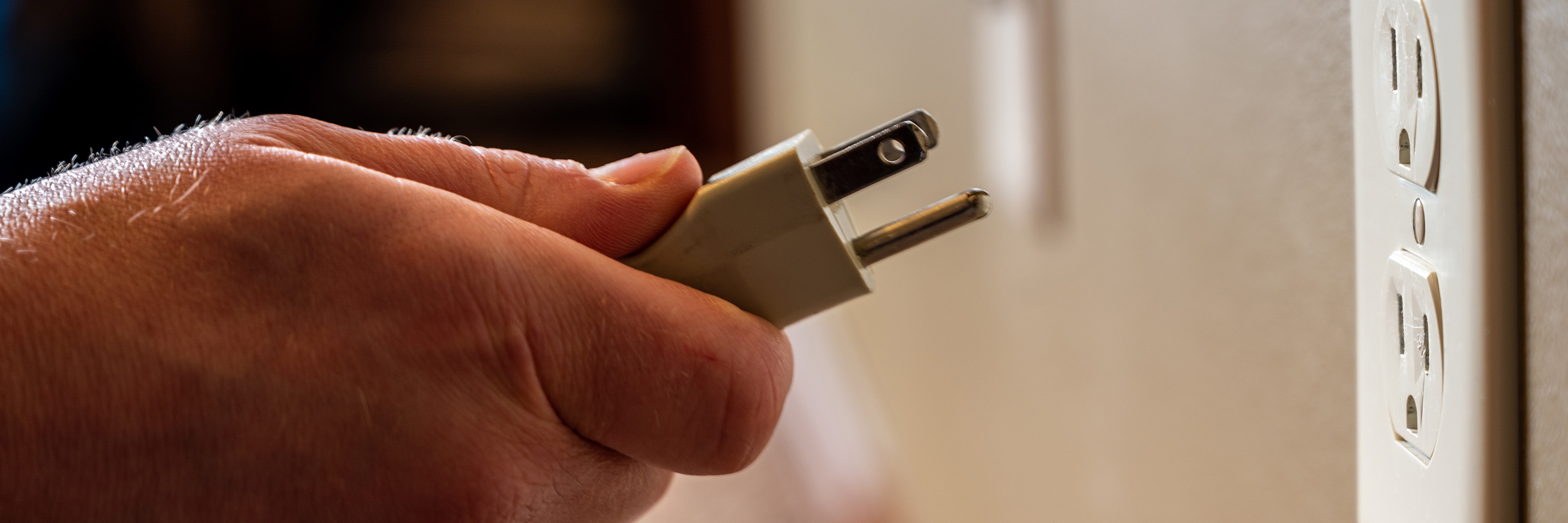 pulling plug out of an outlet