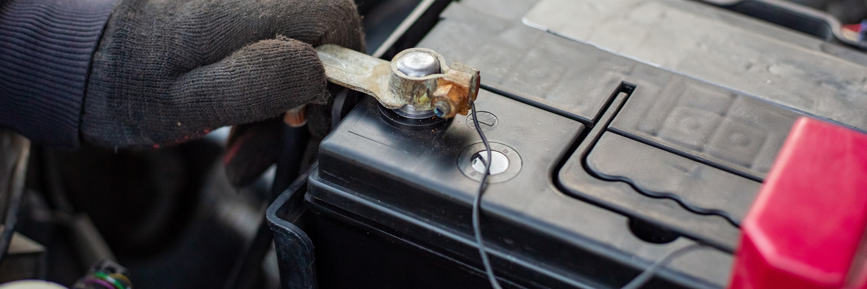 Differentiating Positive and Negative Cables on a Car Battery