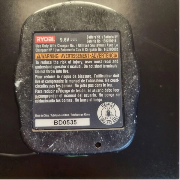 Ryobi drill battery rebuild underside with voltage, chemistry details, and recycling information