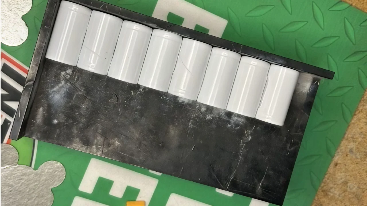 8 NiCad batteries glued together drying in a tray
