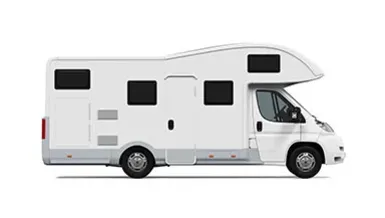 Recreational vehicle parked outdoors for travel and camping
