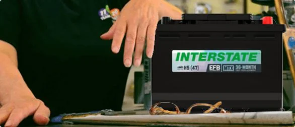 Interstate Enhanced Flooded Battery (EFB) automotive battery displayed in a retail service environment