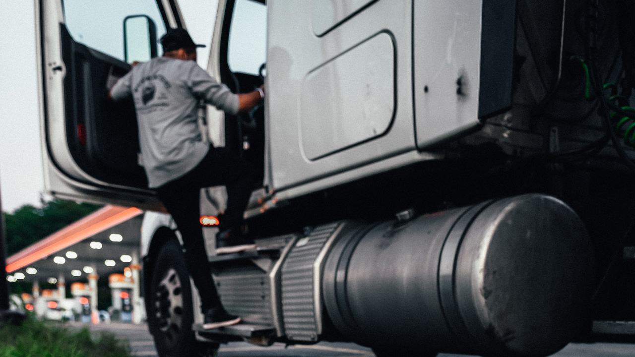 driver getting into semi truck