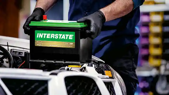 Tech installing an Interstate battery